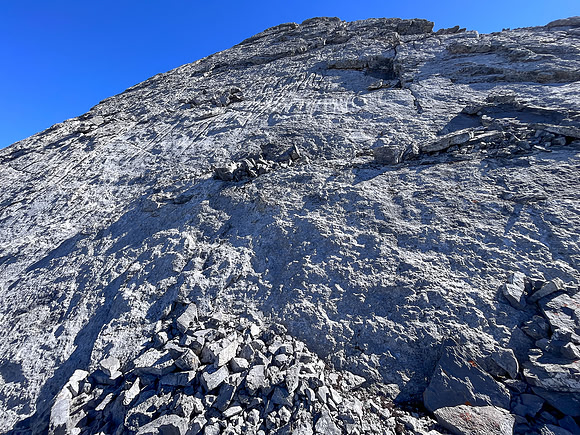Descending the steep upper west face of Cuthead Peak.