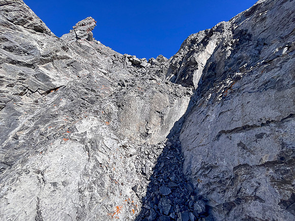 Ascending the steep upper west face of Cuthead Peak.