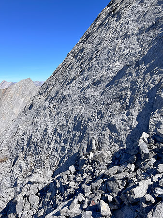 Descending the steep upper west face of Cuthead Peak.