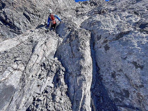 Descending the steep upper west face of Cuthead Peak.