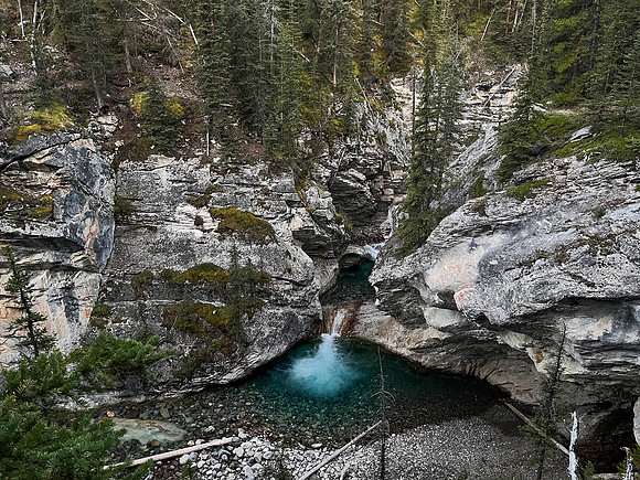 A scenic waterfall near the Flints Park campground with the North Cascade River flowing towards the Cascade River.