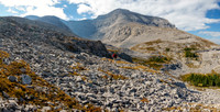 Hiking towards the NW summit of Scrimger and our scree traverse.