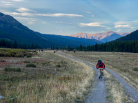 Biking back along the wide Cataract Creek trail. Note the cows and mount Burke.