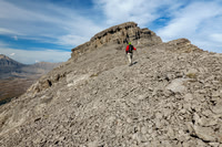 The second cliffband is avoided with a long left traverse on scree.