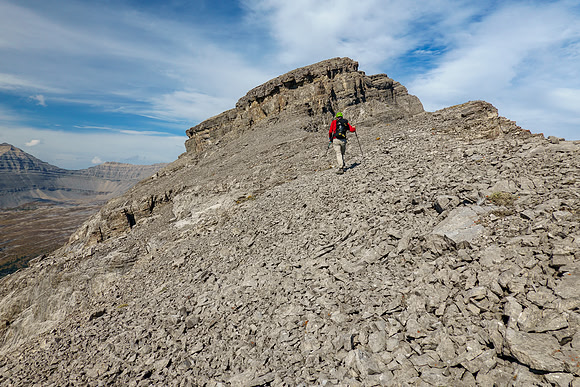 The second cliffband is avoided with a long left traverse on scree.