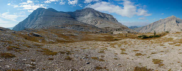 Mount Scrimger from atop the headwall. Route traverses a scree bench under the summit at center.