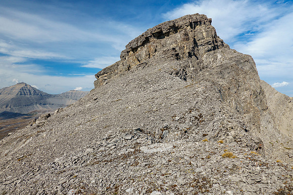 The second cliffband is avoided with a long left traverse on scree.