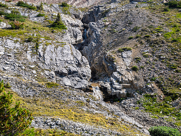 Hiking across Beauty Creek valley under Mount Wurzburg.
