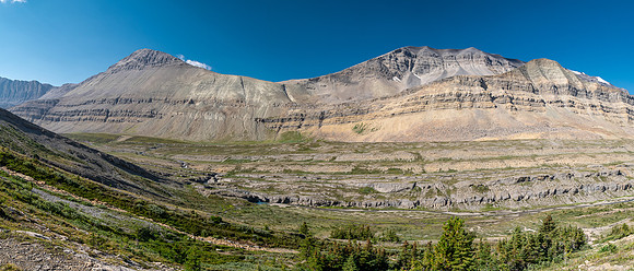 Hiking across Beauty Creek valley under Mount Wurzburg.