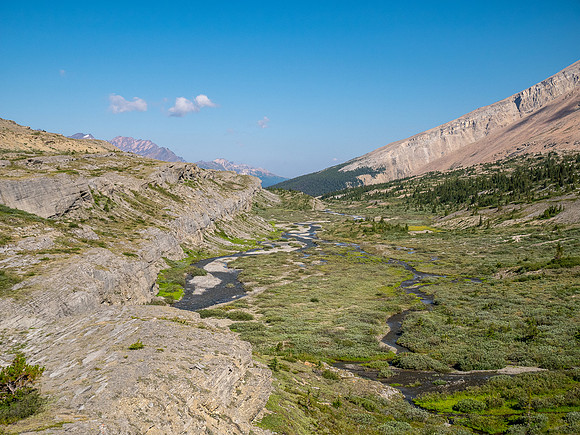Hiking across Beauty Creek valley under Mount Wurzburg.