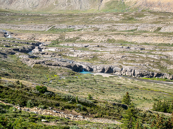 Hiking across Beauty Creek valley under Mount Wurzburg.