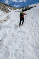 Phil kicks steps as the slope steepens considerably to the ridge.