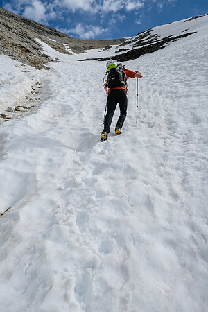 Phil kicks steps as the slope steepens considerably to the ridge.