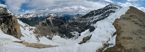 Views up the west ridge to the summit (R). Peaks through the col include Brussilof, Eon, Red Man and White Man Mountain.