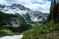 Traversing avalanche slopes back to find the trail in the forest.