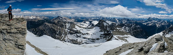 Phil on the summit ridge with the east glacier stretched out underneath him.