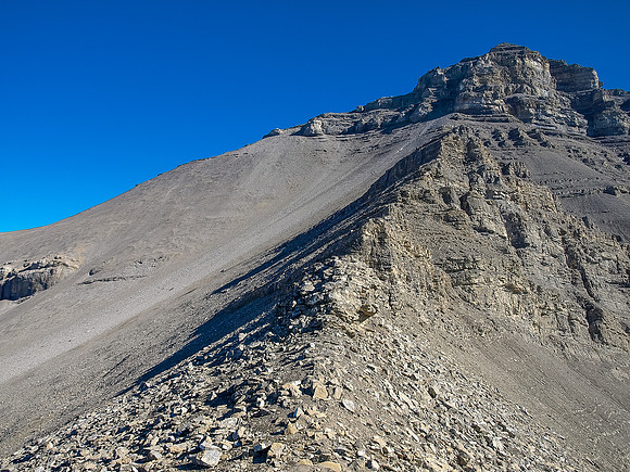 Looking carefully you can spot the trail across the scree bowl above, rising left to the left hand skyline ridge.