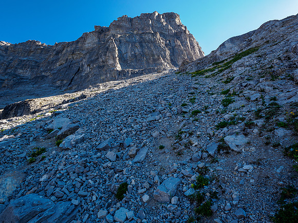 Scrambling loose rubble slopes to the NW2 col.