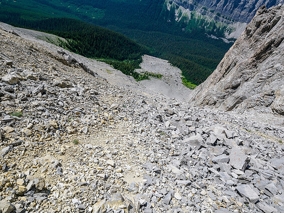 Descending rubble slopes to the boulder field.
