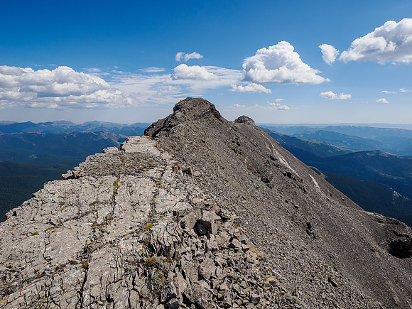 Traversing to the east summit.