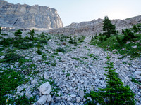 Hiking the boulder field under the col.