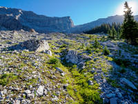 Hiking the boulder field under the col.