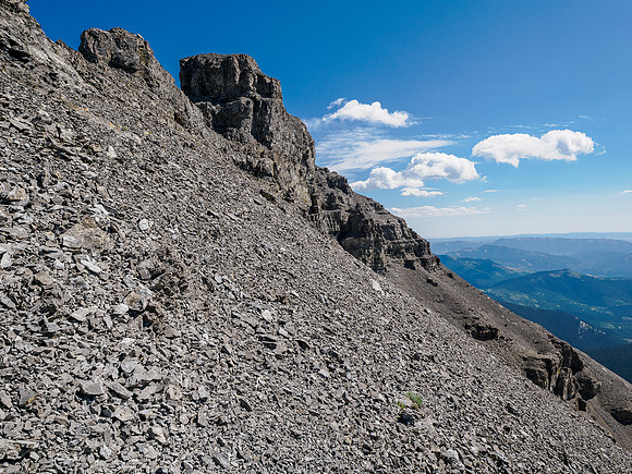 Traversing rubble slopes to the east summit of Battleship Peak.