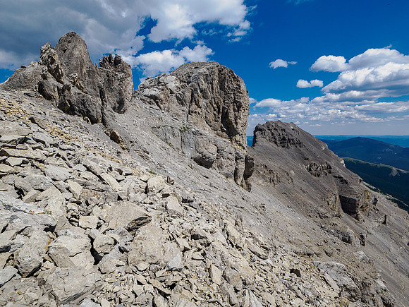 View back to the main summit with the east summit at distant right.