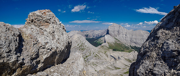 Tornado Mountain through the gap from the down climb (L) and face (R).