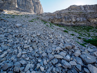 Hiking the boulder field under the col.