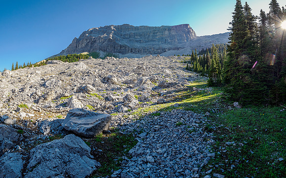 Hiking the boulder field under the col.