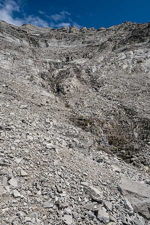 Ascending the lower rubbly SW gully / face of Tornado Mountain.