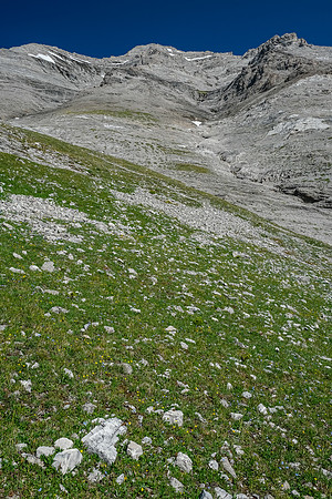 Ascending steeply to the pass under Tornado's SW face.