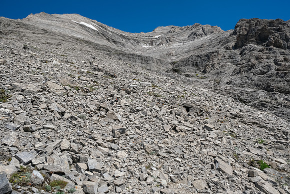 Ascending the lower rubbly SW gully / face of Tornado Mountain.