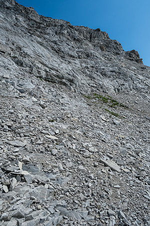Ascending the lower rubbly SW gully / face of Tornado Mountain.
