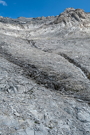 Ascending the lower rubbly SW gully / face of Tornado Mountain.