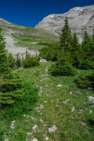 Ascending steeply to the pass under Tornado's SW face.