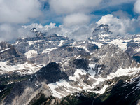 Mount Assiniboine with Eon and Aye to the left of it and Mount Gloria and Aurora in front.