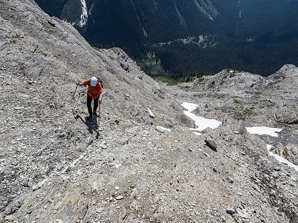 Phil comes up slabby terrain to the summit ridge.