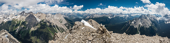 From L to R summits include, Mount Assiniboine, Aurora Byng, Turner, Morrison, Spray Lakes, Shark, Smuts, Birdwood, Warre, Vavasour and Mount Sir Douglas in clouds beyond.