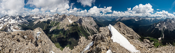 Looking over the impressively deep Currie Creek Valley to the north of Mount Currie. Peaks include Eon, Assiniboine, Aurora, Byng, Morrison and in the distance at right, Shark, Smuts and Birdwood.