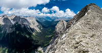 Looking back up the NW ridge of Currie to its summit and down the deep Currie Creek Valley at left to the distant Spray Lakes.