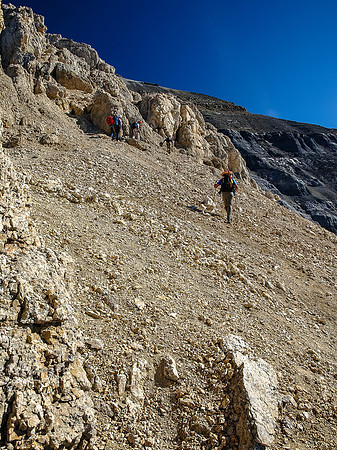 The obvious gray band rock starts to show up above us now as we traverse towards the crux.