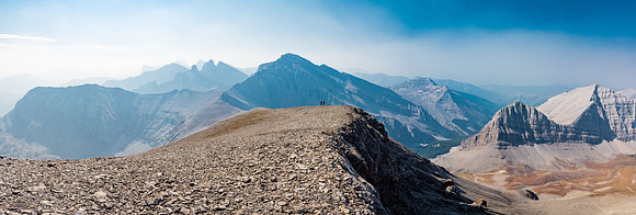 Descending the expansive summit ridge. We will drop to the right towards the col with the unnamed peak below us here.