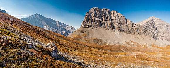 Great fall scenery as we start up the lower western aspect with unnamed peaks to the south and west of the col.