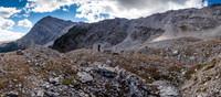 Down the headwall and looking back at our two routes. The treed ledges left of Wietse and the scree traverse above slabby cliffs at right, running up and climber's left.