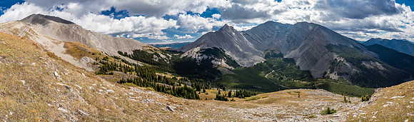 A gorgeous day as we descend the south ridge to our alpine meadow traverse. Gass at left with Mount Lyall at center.
