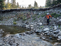 Phil descends to the Oldman River.