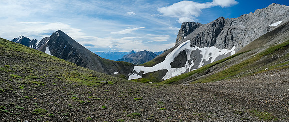 Looking back across the meadows to the first pass. Stelfox at center distance.