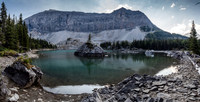 The tranquil Lyall Tarn with Mount Lyall's NE face looming high above.